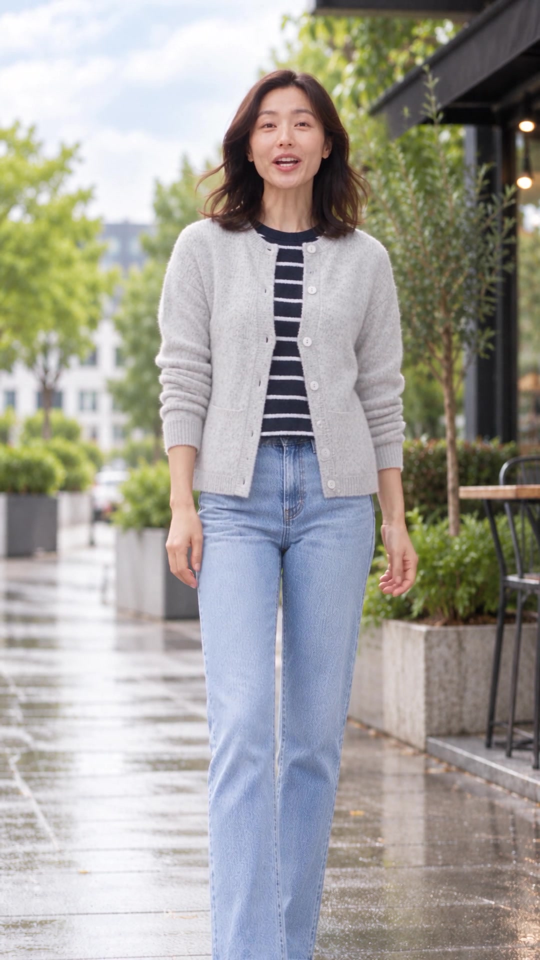 Woman adds a cardigan in the Video 08 opening